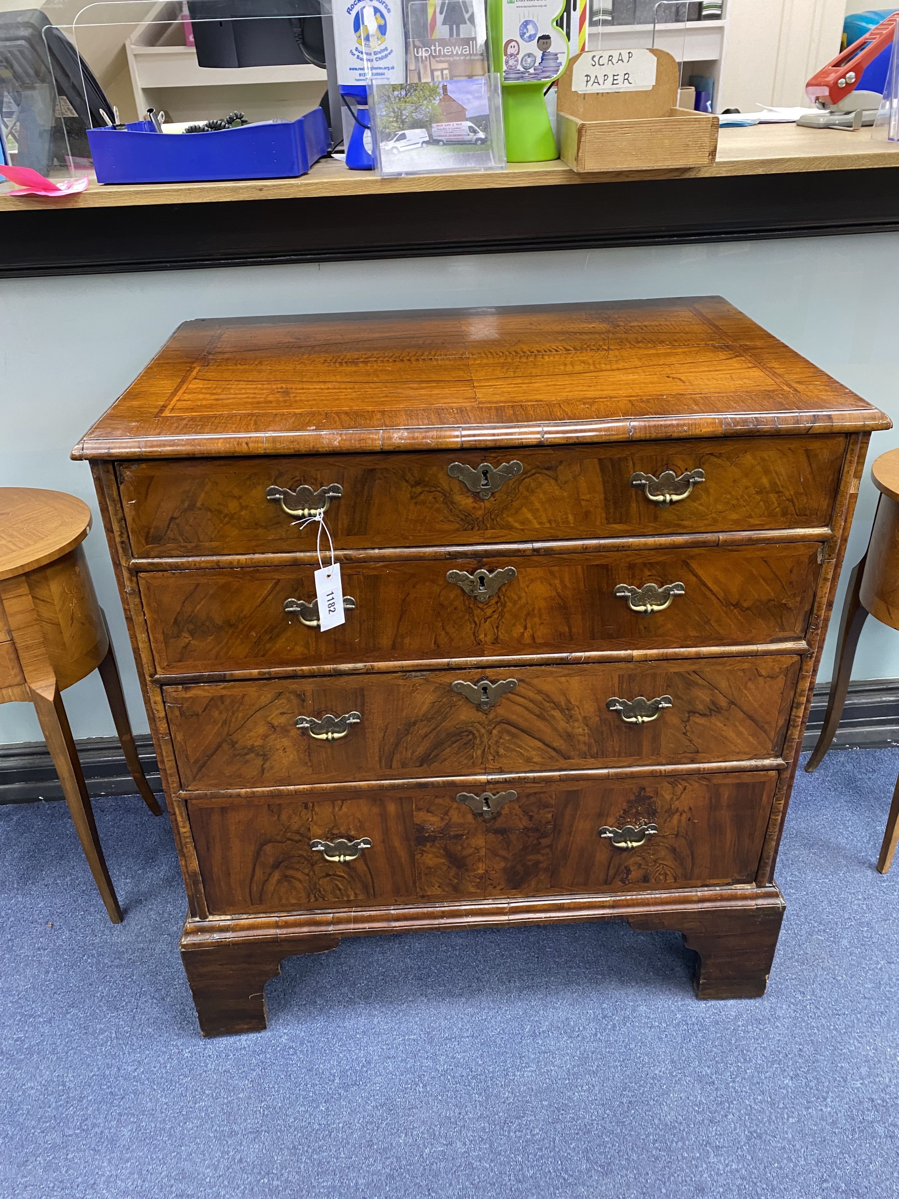 An 18th century and later walnut veneered chest of four graduating drawers raised on bracket feet, width 80cm, depth 52cm, height 88cm